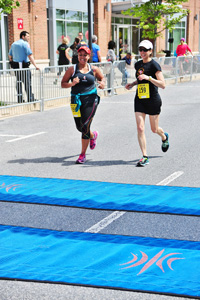 Dana Deighton and Tiffani Tyer crossing finish line